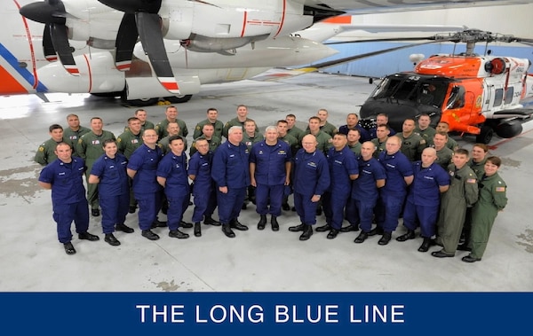 Commandant Bob Papp, Vice Commandant John Currier, and AIRSTA Elizabeth City commander, Captain Joseph Kelly, stand with the aircrews and operation specialists who responded to the HMS Bounty sinking. (U.S. Coast Guard)