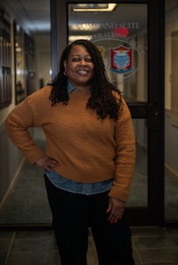 Kimeka Downey, 436th Operations Support Squadron host aviation resources support assistant chief, poses for a photo at Dover Air Force Base, Delaware, Jan. 14, 2026. Downey won the Air Mobility Command’s Outstanding Aviation Resource Manager of the Year 2025. (U.S. Air Force photo by Airman 1st Class Liberty Kuhn)
