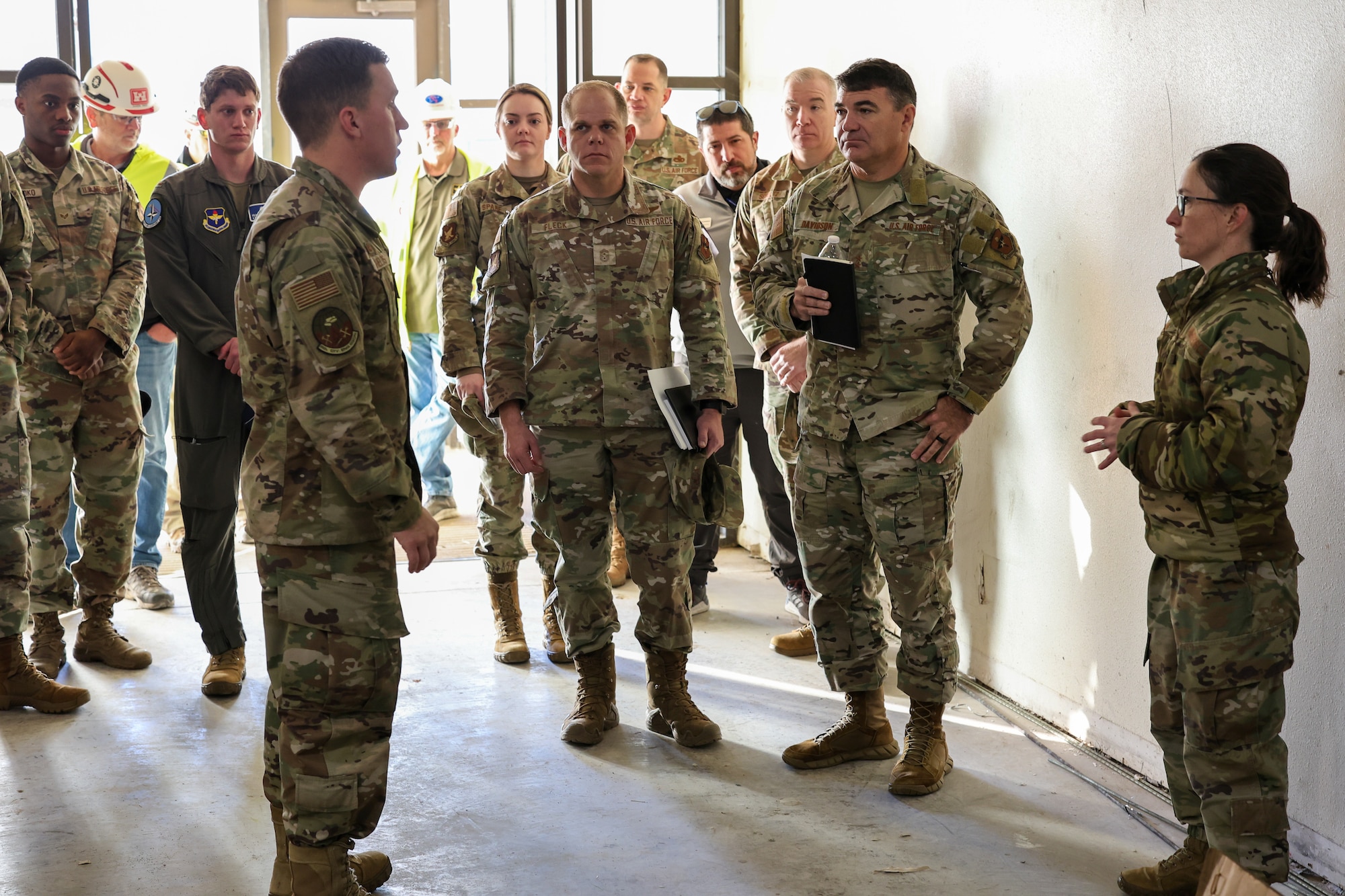 U.S. Air Force Maj. Gen. Wolfe Davidson, Second Air Force commander, and U.S. Air Force Chief Master Sgt. Colin Fleck, Second Air Force command chief, receive a briefing from U.S. Air Force Maj. Bradford Shields, 82nd Civil Engineer Squadron commander, on the ongoing construction of the 361st Training Squadron Aerospace Ground Equipment building at Sheppard Air Force Base, Texas, Jan. 15, 2026.