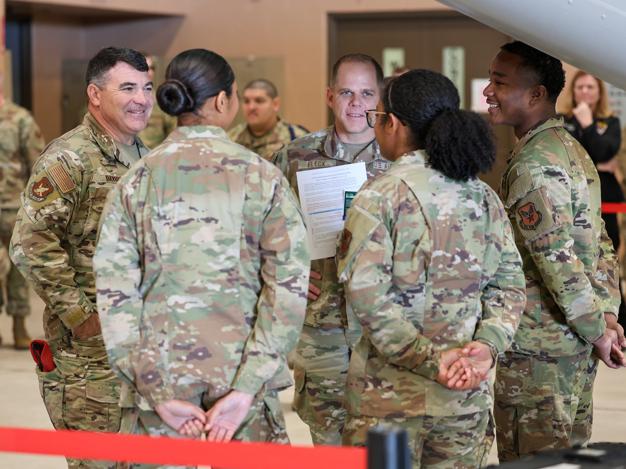 U.S. Air Force Maj. Gen. Wolfe Davidson, Second Air Force commander, and U.S. Air Force Chief Master Sgt. Colin Fleck, Second Air Force command chief, engage with Airmen in Training following a Bracer Forge activity in the 363rd Training Squadron Weapons Hangar at Sheppard Air Force Base, Texas, Jan. 15, 2026.