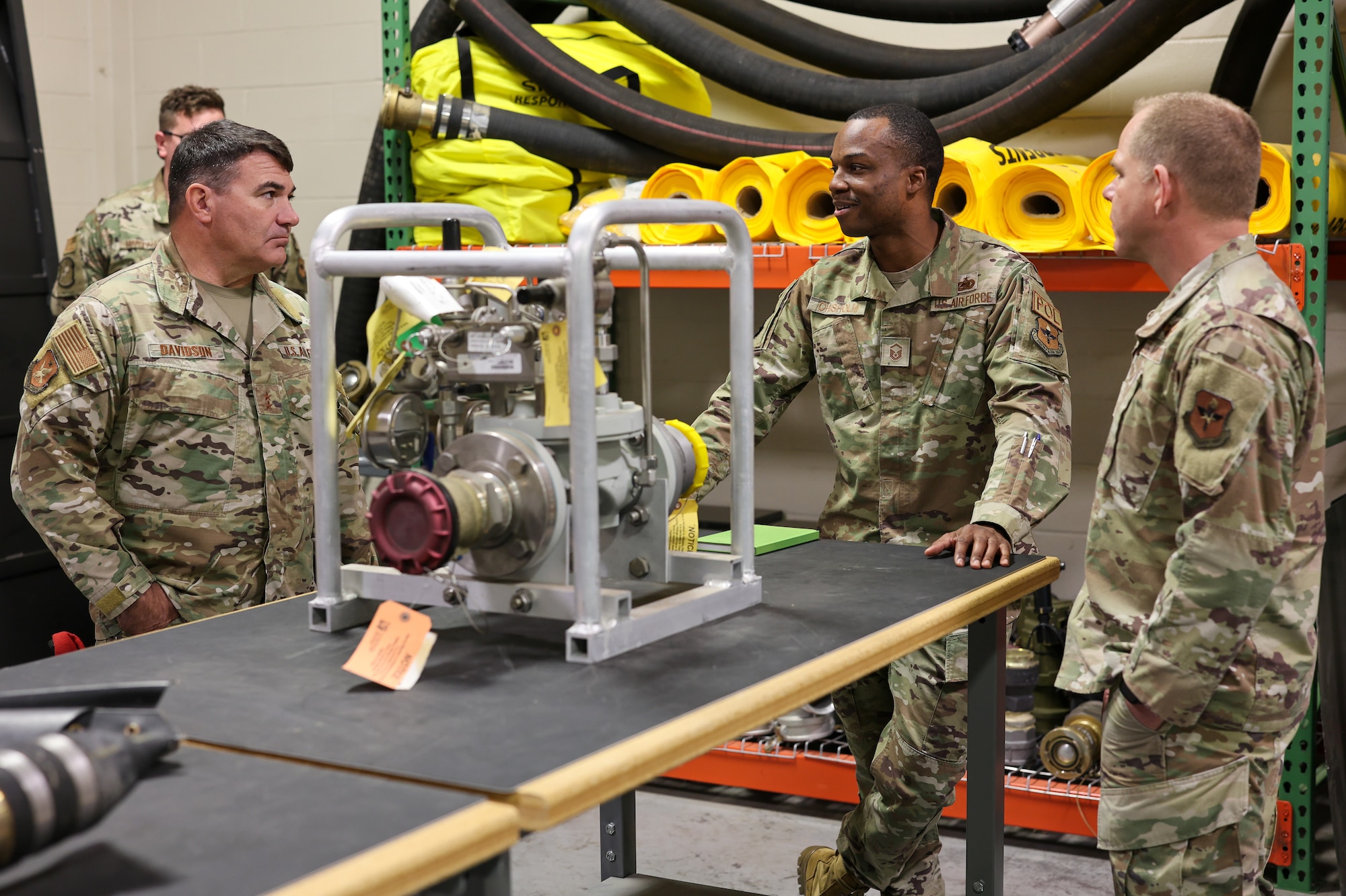 U.S. Air Force Master Sgt. Reuben Chisholm, 364th Training Squadron fuels superintendent, discusses the Versatile Integrating Partner Equipment Refueling kit with U.S. Air Force Maj. Gen. Wolfe Davidson, Second Air Force commander, and U.S. Air Force Chief Master Sgt. Colin Fleck, Second Air Force command chief, at Sheppard Air Force Base, Texas, Jan. 15, 2026.
