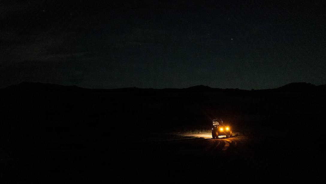 A U.S. Marine with 1st Distribution Support Battalion, Combat Logistics Regiment 1, 1st Marine Logistics Group, recovers cargo operating an extendable boom forklift during air delivery operations on Marine Corps Base Camp Pendleton, California, Jan. 13, 2026.
