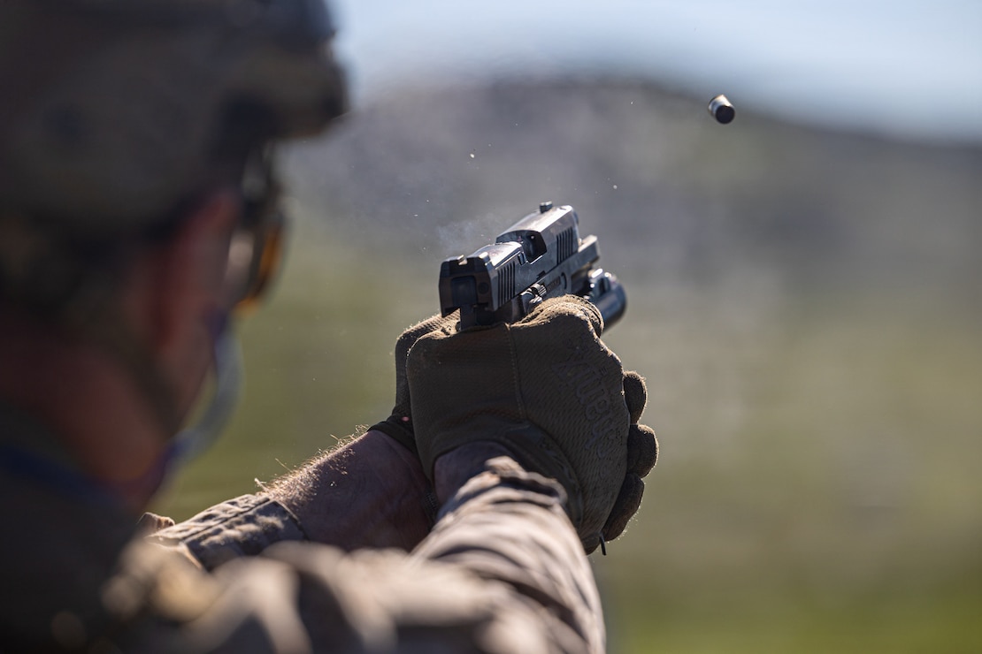 U.S. Marine Corps Sgt. Payton Ottinger, a radio operator with the Maritime Raid Force, 11th Marine Expeditionary Unit, fires an M9 service pistol at a target during a live-fire range at Marine Corps Base Camp Pendleton, California, Jan. 13, 2026.