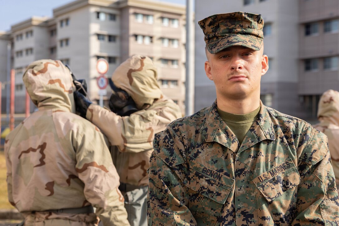 U.S. Marine Corps Lance Cpl. Christopher Benon, a chemical, biological, radiological, and nuclear (CBRN) specialist with Marine Wing Support Squadron (MWSS) 171, Marine Aircraft Group 12, 1st Marine Aircraft Wing, poses for a photo during CBRN training at Marine Corps Air Station Iwakuni, Japan, Nov. 25, 2025. CBRN training is crucial for Marines to remain capable, confident and operation ready in any environment. (U.S. Marine Corps photo by Lance Cpl. Ella Cadby)