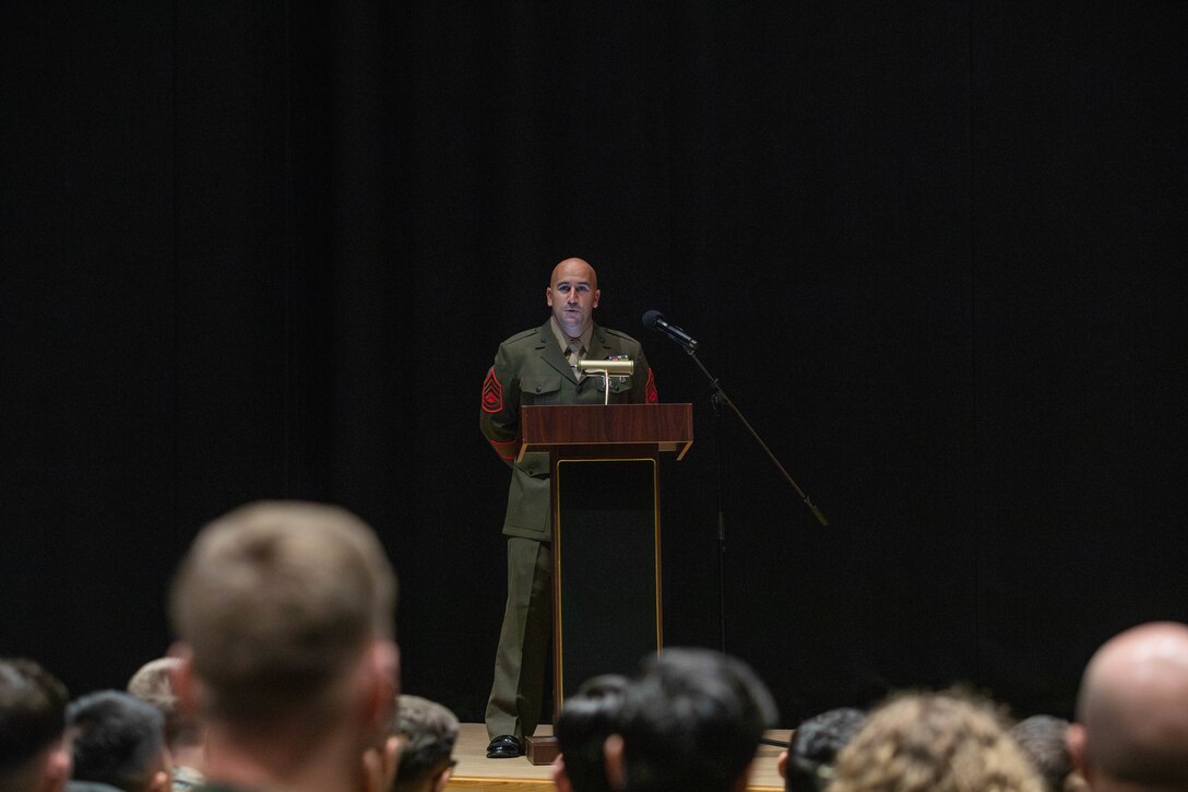 Award recipient, U.S. Marine Corps Gunnery Sgt. Robert Navarro, the officer in charge of the indoor small arms range with Headquarters and Headquarters Squadron, Marine Corps Air Station, and native to Oceanside, California, gives a speech during the Gunnery Sgt. Carlos N. Hathcock II award ceremony at MCAS Iwakuni, Japan, Nov. 4, 2025. Gunnery Sgt. Navarro was awarded the Gunnery Sgt. Carlos N. Hathcock II award for his prestigious work and dedication to improving marksmanship of the ISAR and efficiently training rifle and pistol qualifications. (U.S. Marine Corps photo by Lance Cpl. Siwan Lewis)