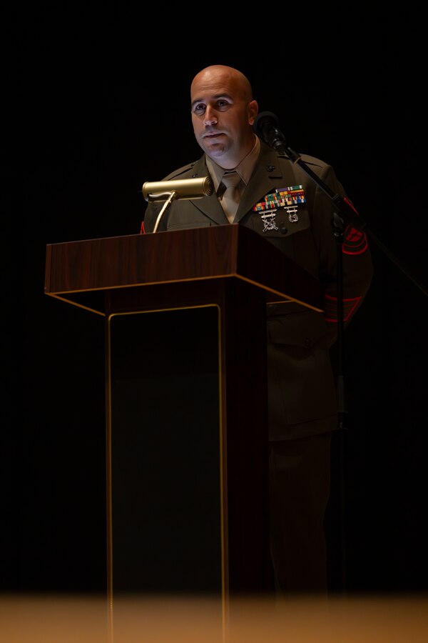 Award recipient, U.S. Marine Corps Gunnery Sgt. Robert Navarro, the officer in charge of the indoor small arms range with Headquarters and Headquarters Squadron, Marine Corps Air Station, and native to Oceanside, California, gives a speech during the Gunnery Sgt. Carlos N. Hathcock II award ceremony at MCAS Iwakuni, Japan, Nov. 4, 2025. Gunnery Sgt. Navarro was awarded the Gunnery Sgt. Carlos N, Hathcock II award for his prestigious work and dedication to improving marksmanship of the ISAR and efficiently training rifle and pistol qualifications. (U.S. Marine Corps photo by Lance Cpl. Isaac De Leon)