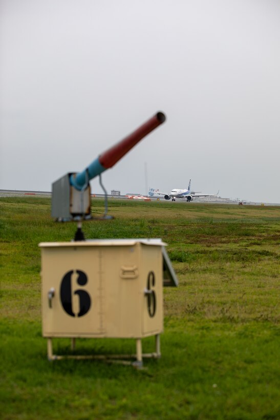 An ANA flight lands at Marine Corps Air Station Iwakuni after a Bird/Wildlife Aircraft Strike Hazard patrol of the flightline at MCAS Iwakuni, Japan, Oct. 3, 2025. The MCAS Iwakuni BASH program is designed to keep runways and the surrounding area free of any wildlife that could pose a threat to daily flight operations. (U.S. Marine Corps photo by Sgt. Randall Whiteman)