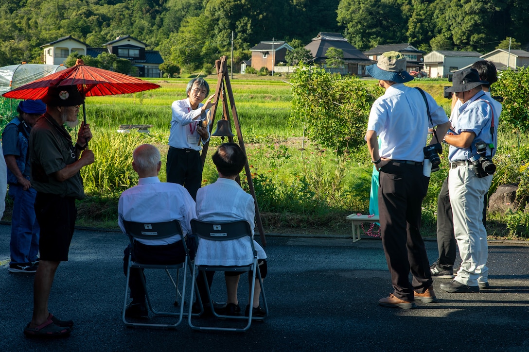 Shuzo Kinoshita, an event organizer, speaks to attendees during an unveiling ceremony in Yanai, Japan, July 28, 2025. Local residents came together to support the memorial in Yanai, Japan, paying tribute to American and Japanese lives lost during World War II. (U.S. Marine Corps photo by Lance Cpl. Micah Taylor)