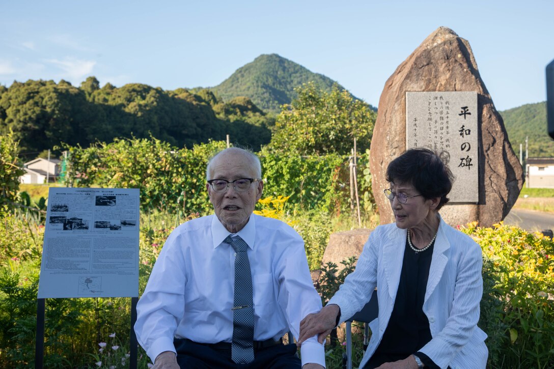 Shigeaki Mori, left, a Japanese historian and a survivor of the atomic bombing of Hiroshima, and his wife, Kayoko Mori, answers questions from the press during a memorial event, Yanai, Japan, July 28, 2025. Mr. Mori is a prominent historian, and his work was critical in documenting the fate of the Lonesome Lady and her crew. (U.S. Marine Corps photo by Lance Cpl. Micah Taylor)