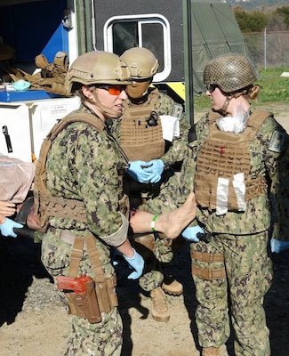 Lt. Cmdr. Rachael Robeck, physician assistant assigned to Expeditionary Resuscitative Surgical System (ERSS) 15, based out of Navy Medicine Readiness and Training Command (NMRTC) Camp Pendleton, provides simulated trauma care to a casualty during an ERSS training conducted by Naval Expeditionary Medicine Warfighter Development Center (NEMWDC) at Camp Pendleton, California, Dec. 16, 2025. The scenario replicates penetrating chest trauma and requires coordinated team-based care in a field environment. “Scenarios like this reinforce the importance of rapid assessment and decisive intervention when managing penetrating chest trauma in a field environment,” said Robeck. The ERSS 15 team is currently assigned to the Naval Strategic Health Alliance for Readiness and Performance (SHARP), a partnership with Penn Medicine that embeds active-duty Navy trauma personnel into Penn Presbyterian’s Level I trauma center. This initiative sustains combat casualty care skills and provides hands-on experience with complex civilian trauma.  (U.S. Navy photo by Petty Officer 1st Class Trevin Perry)