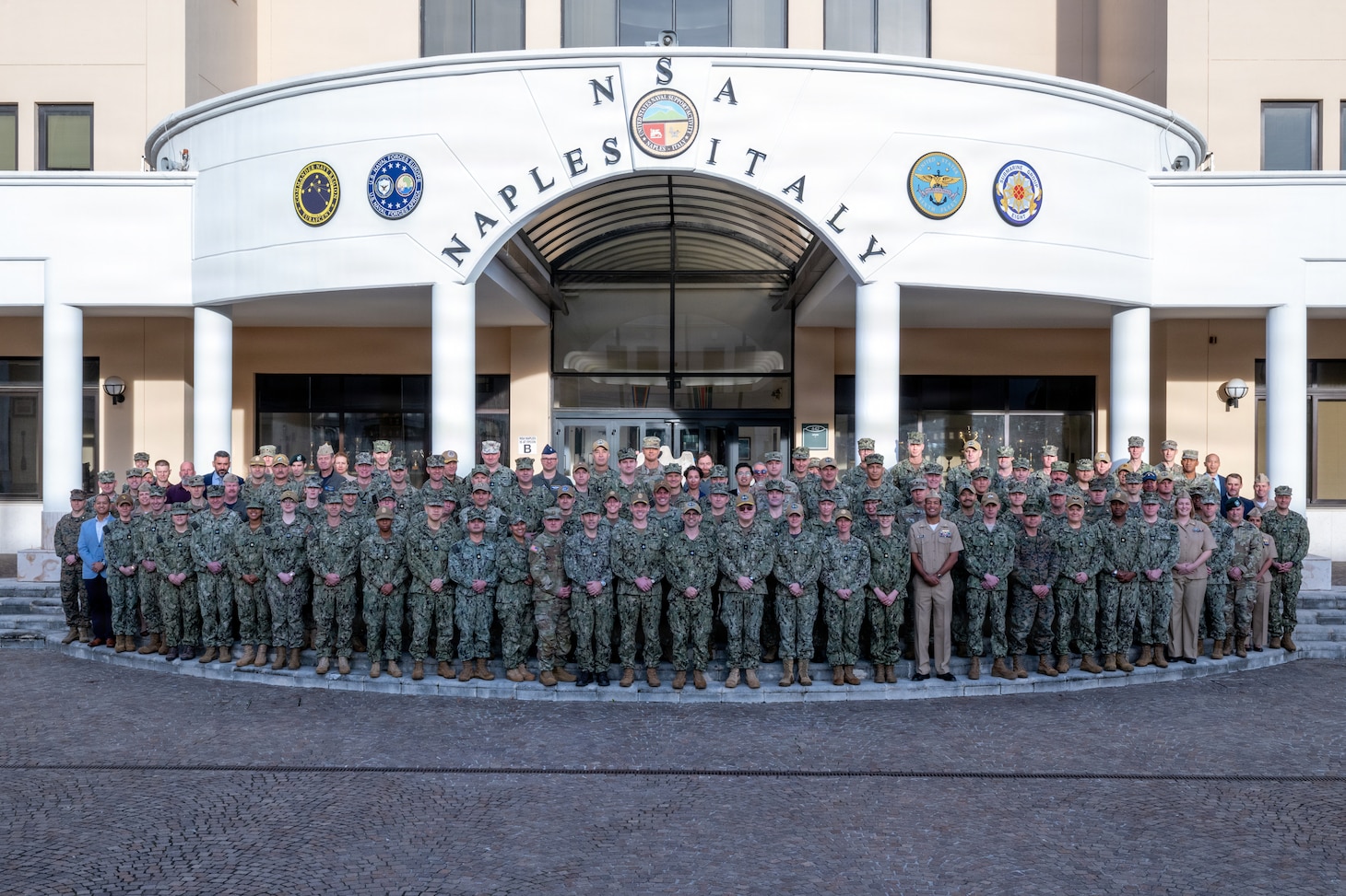 U.S. service members attending the January 2026 Maritime Security Cooperation and Attaché Symposium gather for a group photo at U.S Naval Support Active Naples, Italy, Jan. 12, 2026.