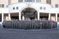U.S. service members attending the January 2026 Maritime Security Cooperation and Attaché Symposium gather for a group photo at U.S Naval Support Active Naples, Italy, Jan. 12, 2026.