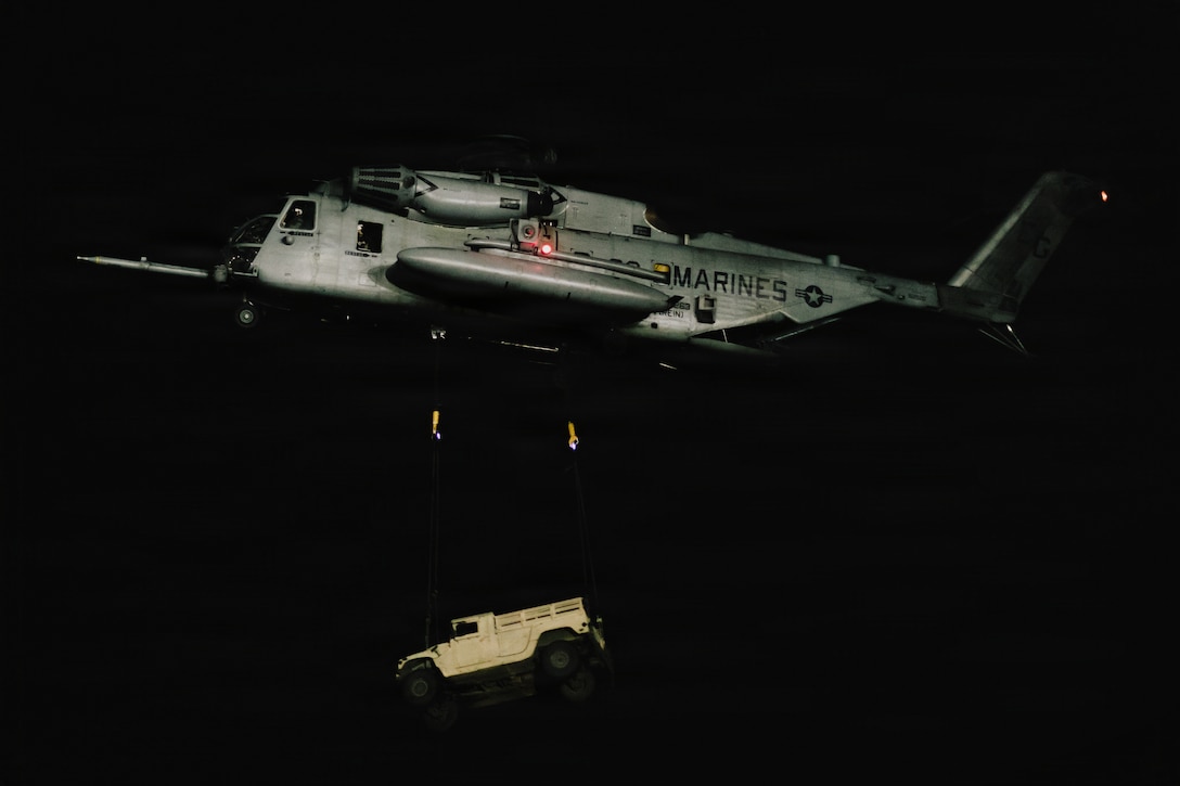 A U.S. Marine Corps CH-53E Super Stallion with Marine Medium Tiltrotor Squadron (VMM) 263 (Reinforced), 22nd Marine Expeditionary Unit (Special Operations Capable), lifts a Humvee during an external lift exercise on Camp Santiago, Puerto Rico, Jan. 5, 2025. U.S. military forces are deployed to the Caribbean in support of the U.S. Southern Command mission, Department of War-directed operations, and the president's priorities to disrupt illicit drug trafficking and protect the homeland. (U.S. Marine Corps photo)