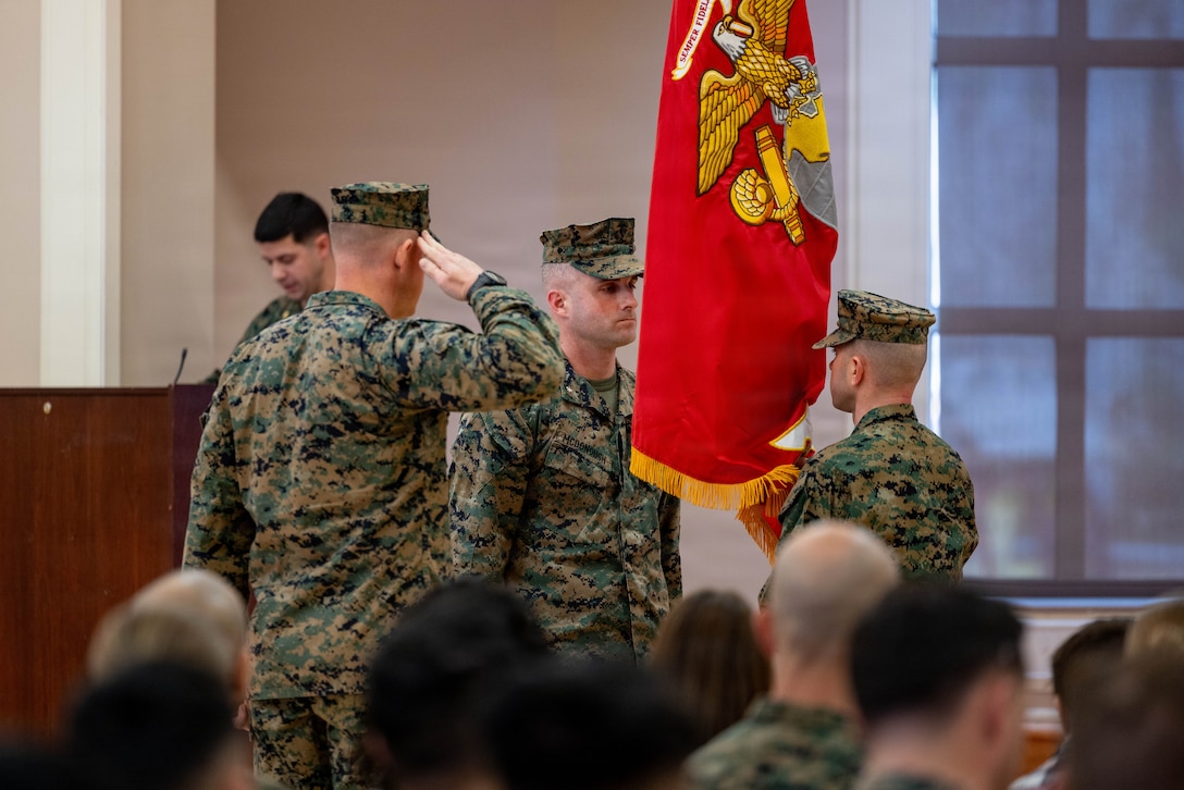 U.S. Marine Corps Lt. Col. Robert Epstein, the oncoming commanding officer of 2nd Intelligence Battalion, II Marine Expeditionary Force Information Group, receives the colors from Lt. Col. Douglas McDonough, the off-going commanding officer, during a change of command ceremony at Marine Corps Base Camp Lejeune, North Carolina, Jan. 14, 2026. The change of command ceremony symbolizes the passing of authority and responsibility from the off-going to the oncoming commanding officer. During the ceremony, McDonough relinquished command of 2nd Intel Bn. to Epstein. (U.S. Marine Corps photo by Lance Cpl. Channah Chilton)
