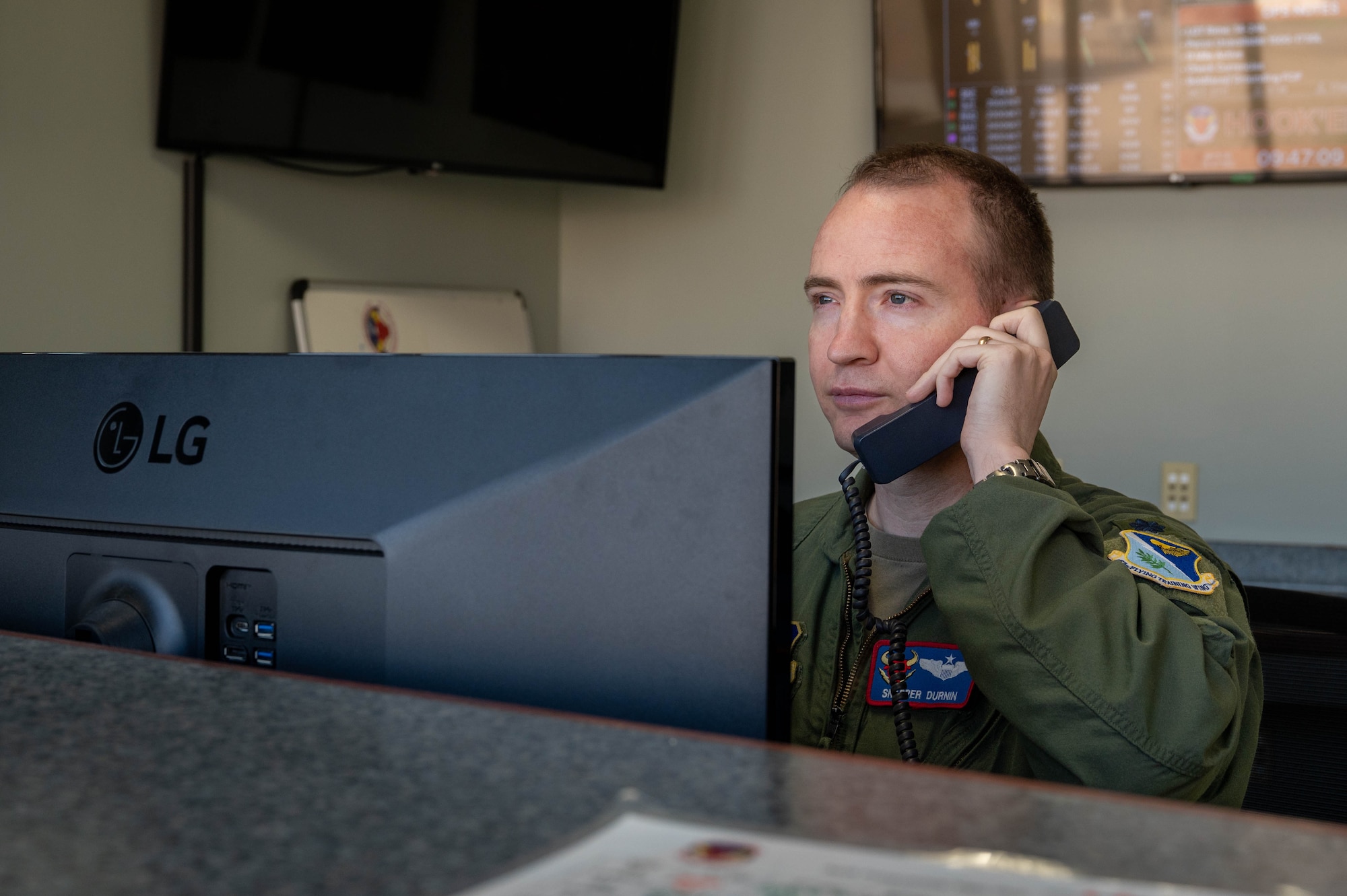 A pilot makes a phone call.