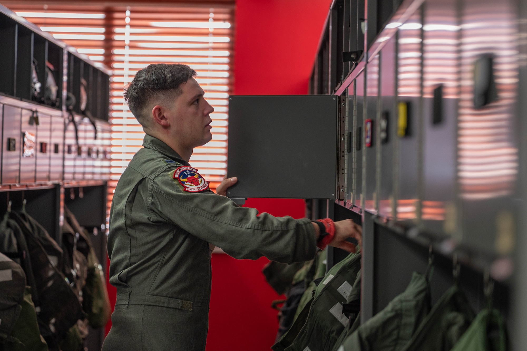A pilot stores flying gear in a locker.