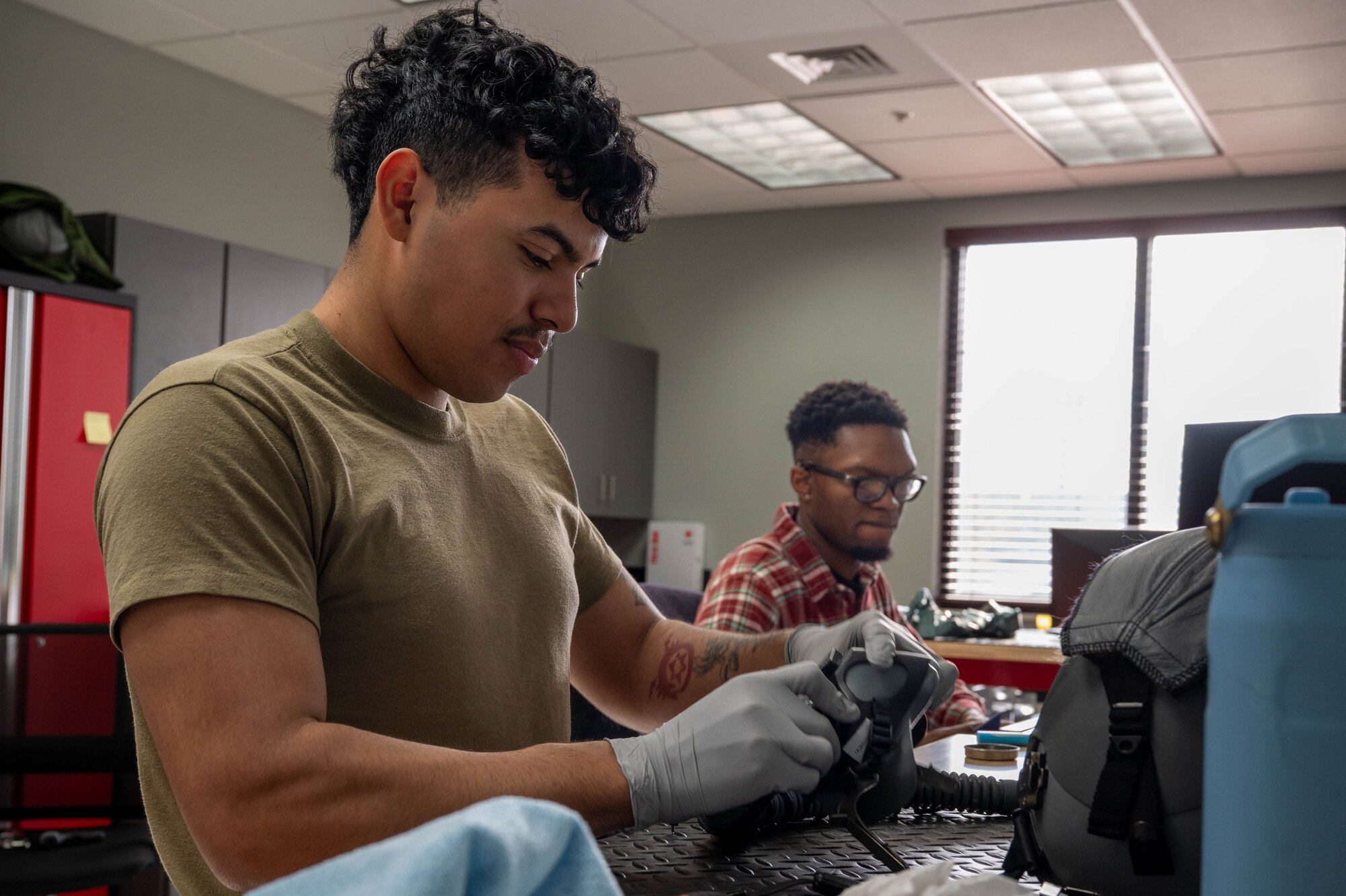AFE technicians clean flying gear.