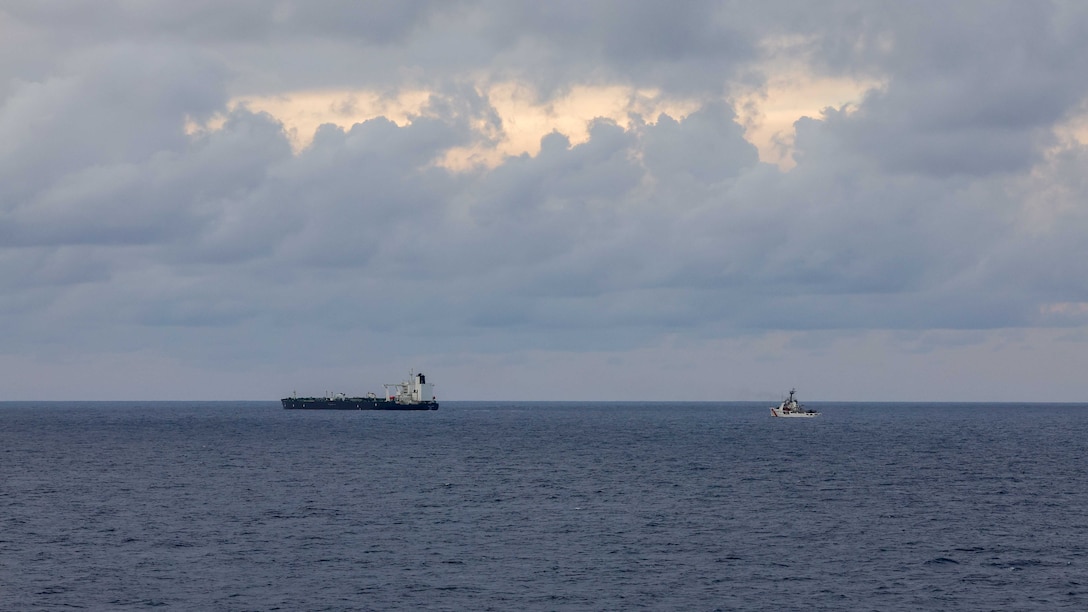 U.S. Coast Guard Cutter Vigilant (WMEC 617), right, sails in the Western Atlantic Ocean while escorting a motor tanker after a right of visit boarding, Jan. 7, 2026. Vigilant escorted the motor tanker, which was seized by a Coast Guard tactical boarding team with support from the Department of War, for operating as a vessel without nationality in the Caribbean Sea