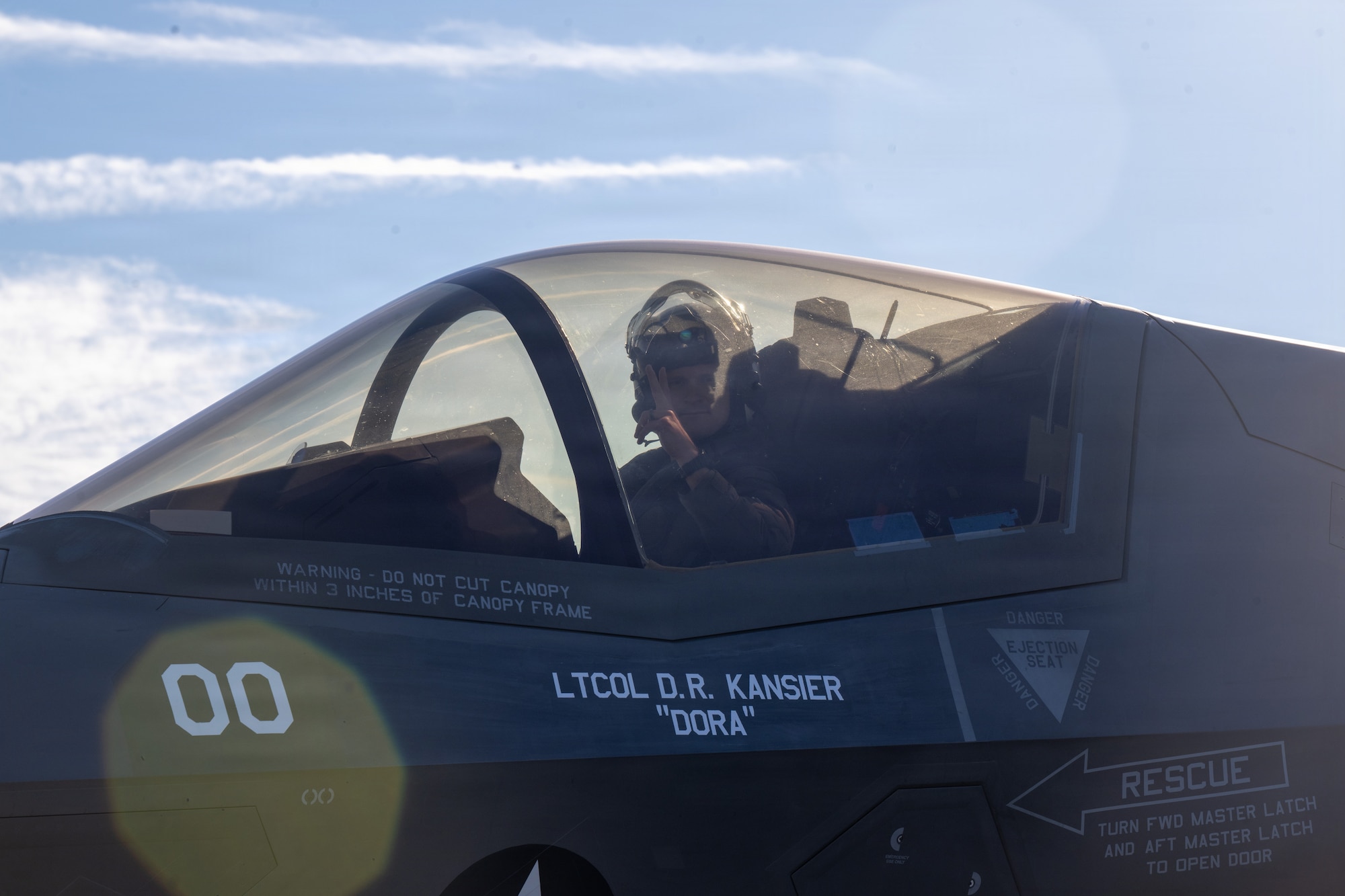 A U.S. Marine pilot assigned to Marine Fighter Attack Squadron 533 makes a peace sign at the camera during a Combat Search and Rescue Training Exercise at Moody Air Force Base, Georgia Jan. 13, 2026. The joint exercise integrated Marine Corps and Air Force aviation assets to practice coordinated flight operations in support of combat search and rescue missions in contested environments. (U.S. Air Force photo by Senior Airman Iain Stanley)