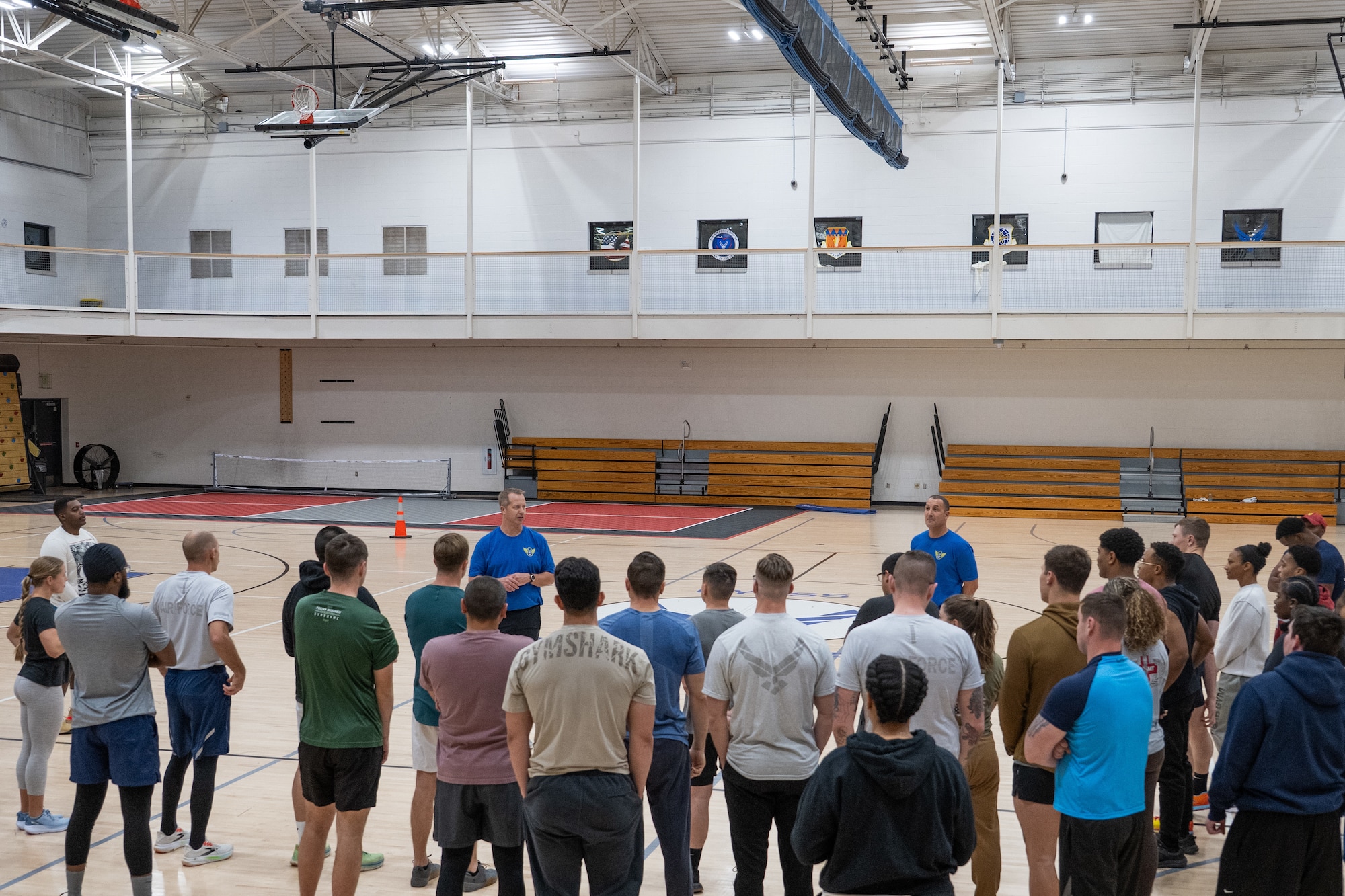 U.S. Air Force Maj. Gen. Ty Neuman, Eighth Air Force and Joint-Global Strike Operations Center commander, and Chief Master Sgt. Brandon Wolfgang, Eighth Air Force command chief and J-GSOC senior enlisted leader, speak with 7th Bomb Wing Airmen during a physical training session at Dyess Air Force Base, Texas, Jan. 13, 2026. Neuman and Wolfgang began their morning completing a physical training session with Dyess Airmen, highlighting the importance of the Department of War’s focus on lethality, accountability, standards and readiness. (U.S. Air Force photo by Airman 1st Class Caleb Schellenberg)