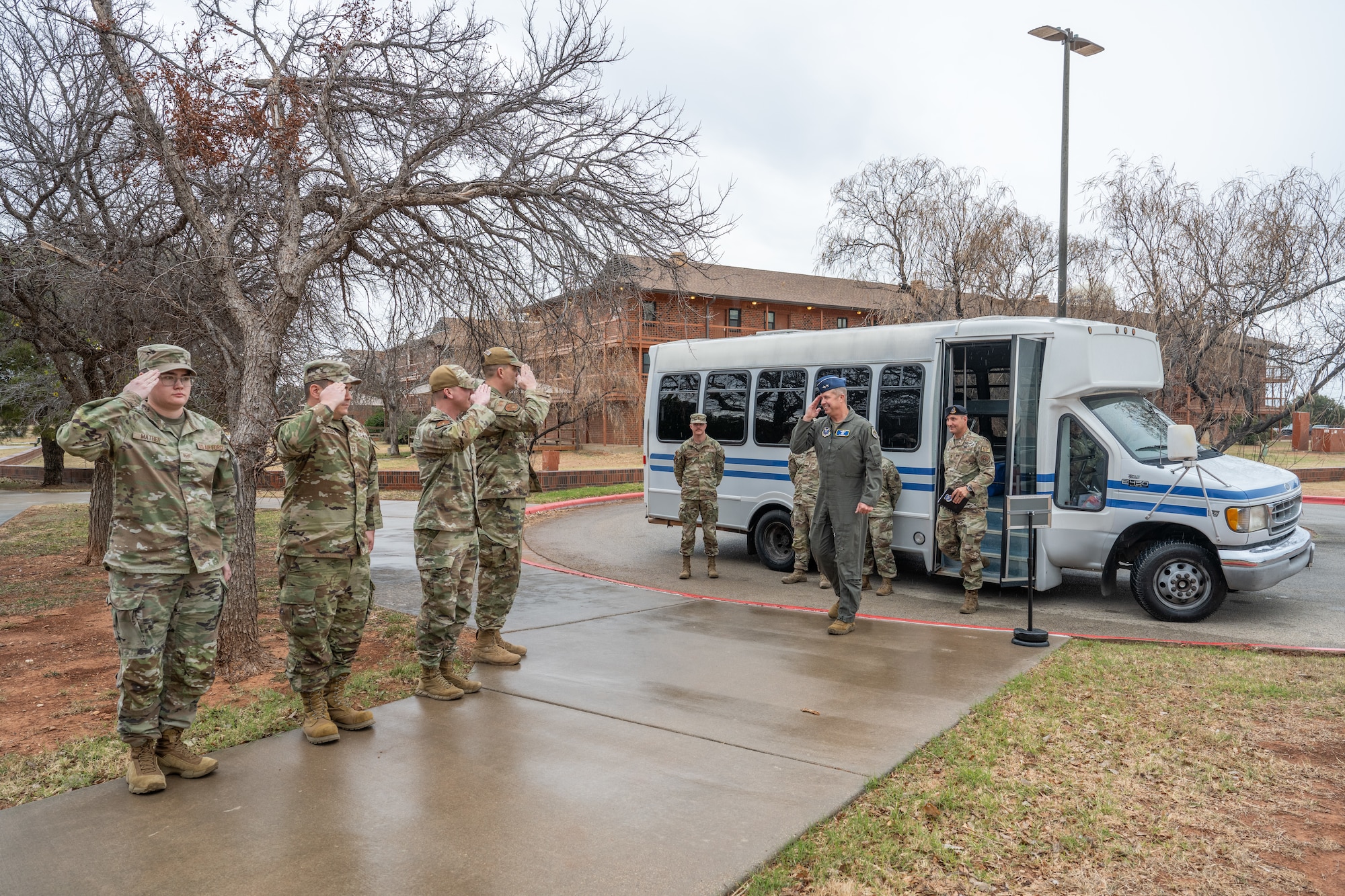 U.S. Air Force Airmen assigned to the 7th  Bomb Wing salute Maj. Gen. Ty Neuman, Eighth Air Force and Joint-Global Strike Operations Center commander, as he exits a surrey at Dyess Air Force Base, Texas, Jan. 13, 2026. Neuman shared meals with Dyess Airmen to gain insight into their challenges, successes and dedication to the mission. (U.S. Air Force photo by Airman 1st Class Caleb Schellenberg)