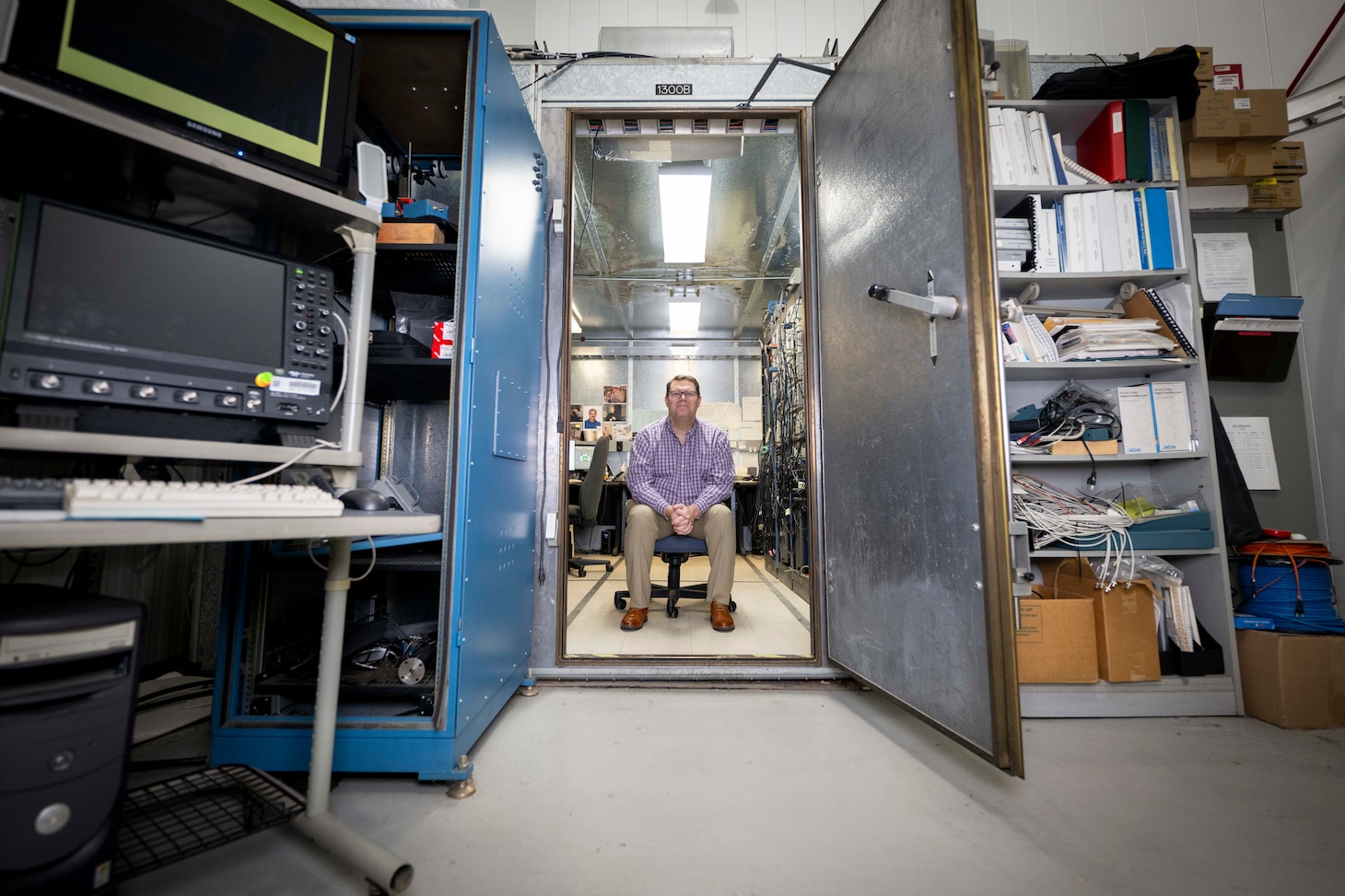Matthew Wolford, Ph.D., U.S. Naval Research Laboratory (NRL) research chemist, poses for a photo in the Electra shield room in Washington, D.C., Jan. 8, 2026. Scientists at NRL use the shield room to control operation and diagnostic outputs of the Electra laser facility. (U.S. Navy photo by Sarah Peterson)