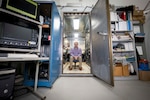 Matthew Wolford, Ph.D., U.S. Naval Research Laboratory (NRL) research chemist, poses for a photo in the Electra shield room in Washington, D.C., Jan. 8, 2026. Scientists at NRL use the shield room to control operation and diagnostic outputs of the Electra laser facility. (U.S. Navy photo by Sarah Peterson)