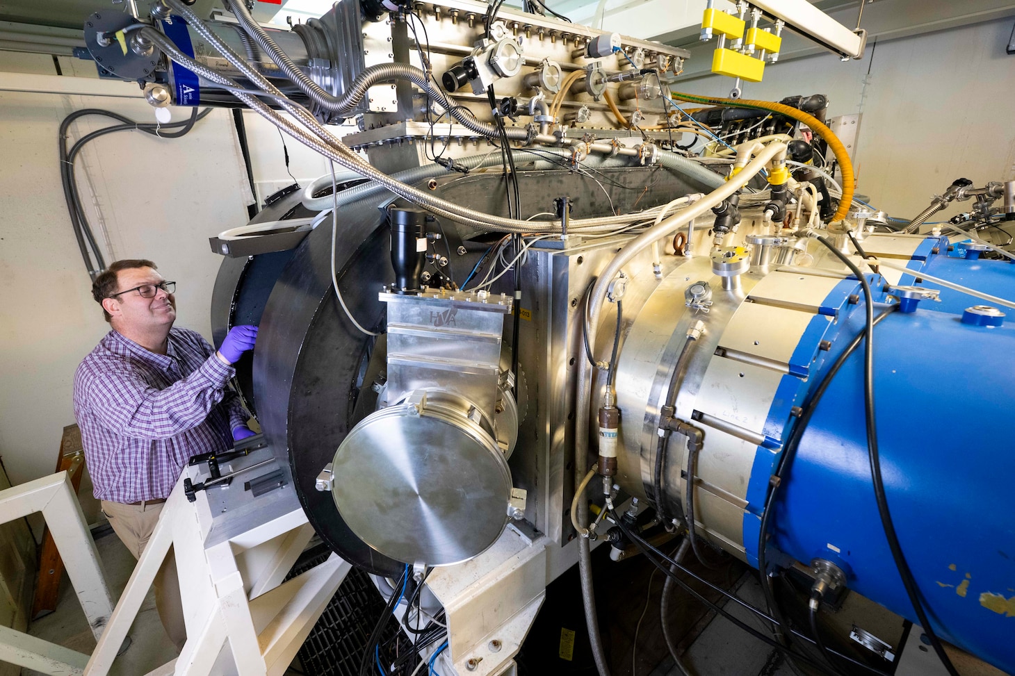 research chemist, adjusts a photodiode diagnostic on an argon fluoride laser in Washington, D.C., Jan. 8, 2026. Wolford uses the photodiode to measure the intensity of the laser and determine its efficiency for fusion energy applications. (U.S. Navy photo by Sarah Peterson)