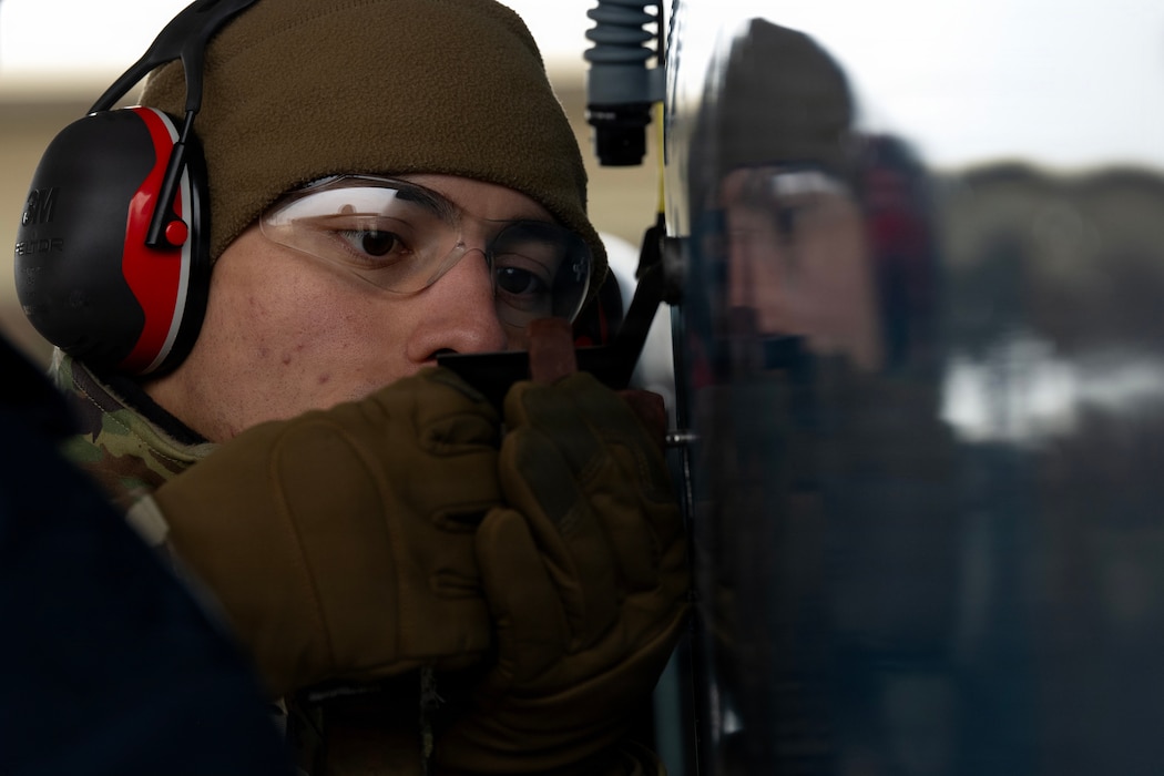 An Airman inspects an aircraft