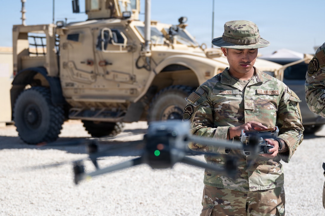 U.S. Air Force Staff Sgt. Joel Mar Paras, 378th Expeditionary Security Forces Squadron Red Air program manager, pilots an unmanned aircraft within the U.S. Central Command area of responsibility, Nov. 4, 2025. Paras advances the 378th ESFS’s modernization efforts by creating unmanned aircraft training that prepares defenders to identify and respond to potential threats to the installation. (U.S. Air Force photo by Senior Airman De’Quan Simmons)