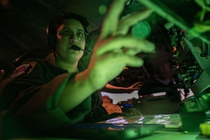 Tech. Sgt. Nasia Tollinchi, 350th Air Refueling Squadron boom operator, McConnell Air Force Base, Kansas, performs pre-flight duties at Davis-Monthan Air Force Base, Arizona Dec. 21, 2025. Tollinchi ensured equipment was strapped down, verified serviceable flight equipment as part of her pre-flight duties. (U.S. Air Force photo by Senior Airman Paula Arce)