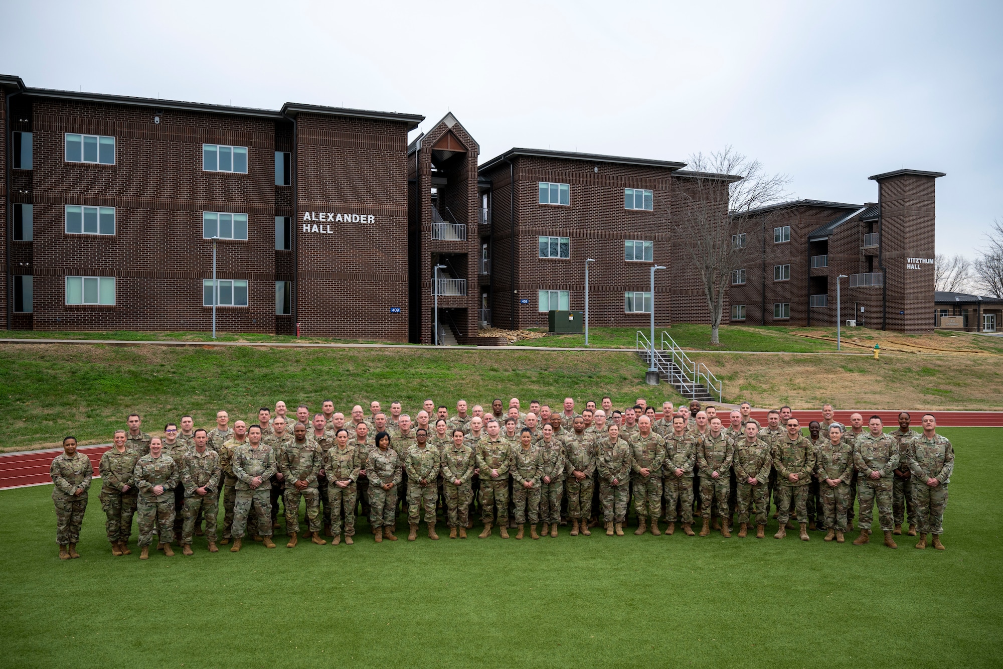 U.S. Airmen gather for a group photo during the Chief Master Sergeant Orientation Course (CMSOC), Jan. 8, 2026, at McGhee Tyson Air National Guard Base, Tennessee. The I.G. Brown Training and Education Center hosted the CMSOC, which provides newly selected chief master sergeants with advanced leadership education and a strategic-level perspective. (U.S. Air National Guard photo illustration by Senior Master Sgt. Timothy Kinnan) Photo was retouched removed distracting items from the background.