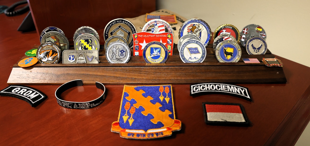 Some of the many coins and badges Command Chief Master Sgt. Christopher Mertz has received during his decades of military service.