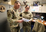 Command Chief Master Sgt. Christopher Mertz of Troy, Ill., discusses professional development with a fellow Airman at the Illinois Air National Guard’s headquarters in Springfield on Jan. 10. Mertz started as the Illinois Air National Guard’s new State Command Chief Master Sergeant on Oct. 1. He has created a “Career Development Roadmap” to assist Airmen as they progress. (Photo by Army Sgt. Geraldo Valdes, Illinois National Guard Public Affairs)