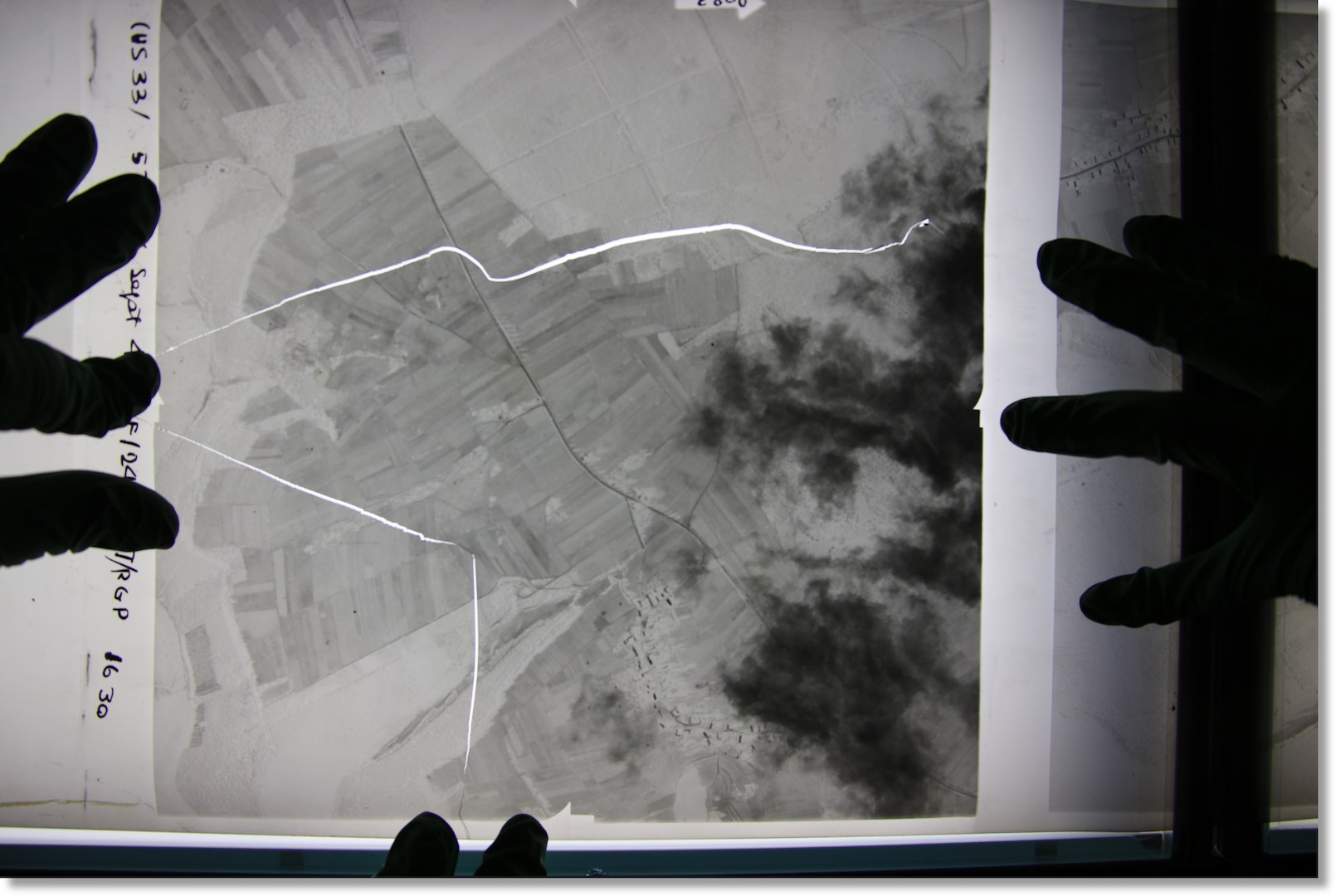 Geospatial analysts look at an overview of geospatial imagery, on Dec. 3, 2025. analysts face several challenges when collecting film.