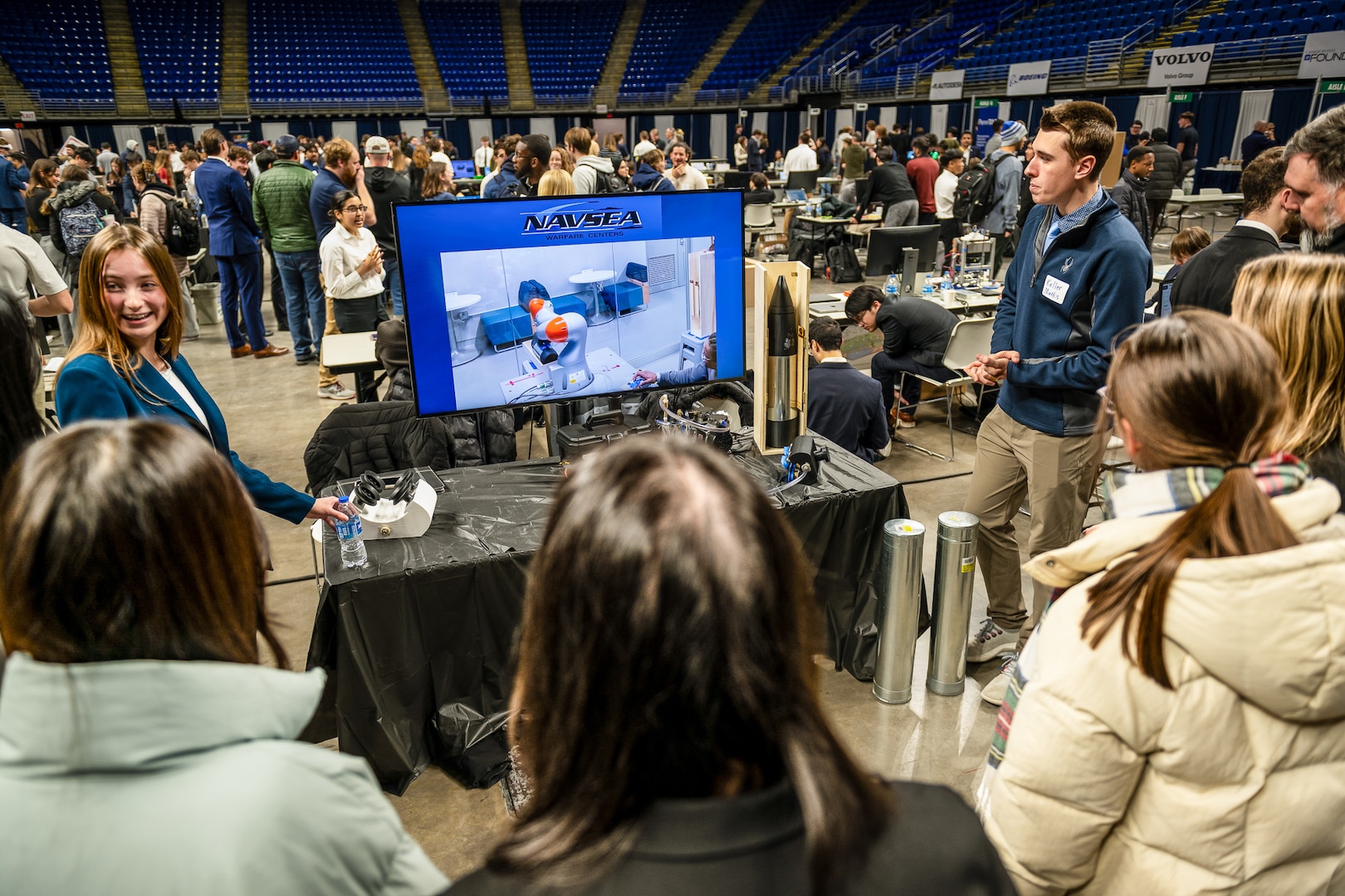 PENN STATE, Pa. – Penn State engineering students Keller Mardis and Victoria Walker talk about their custom end-of-arm tool during Capstone Project Showcase at Penn State College of Engineering’s Learning Factory on Dec. 11, 2025. The capstone project was sponsored by Naval Surface Warfare Center Dahlgren Division and won second place during the showcase. (Poornima Tomy/Penn State College of Engineering)