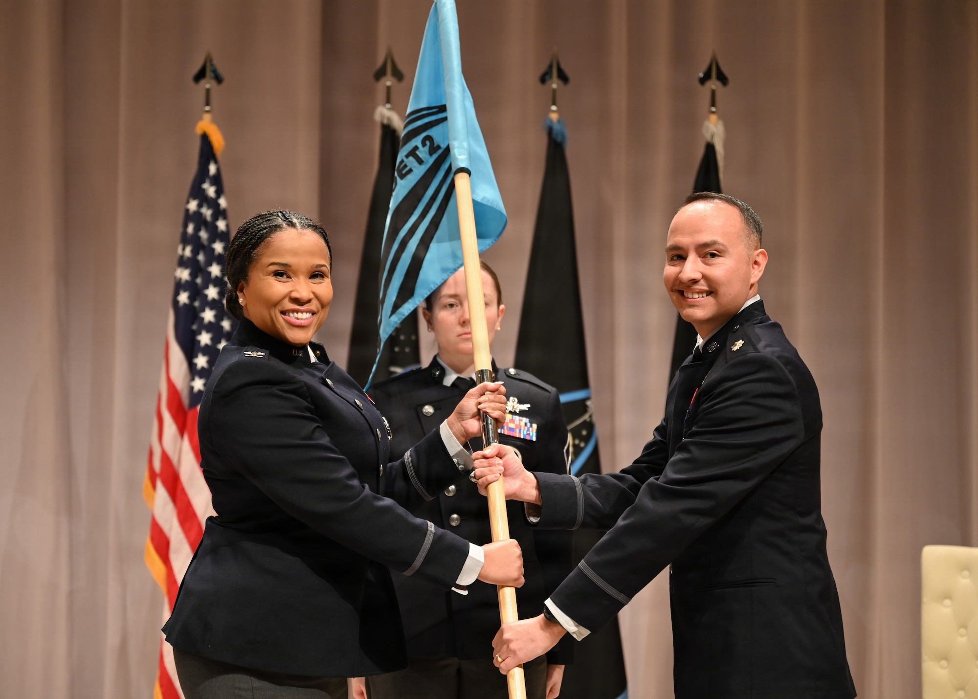 U.S. Space Force Col. Alison Gonzalez presents the command guidon to Lt. Col. Johann Pambianchi during an assumption of command ceremony for Space Delta 13 Detachment 2 at Texas A&M University in College Station, Texas, Jan. 20, 2026. Detachment 2 executes the Captain’s Leadership Course which began today in partnership with the university.