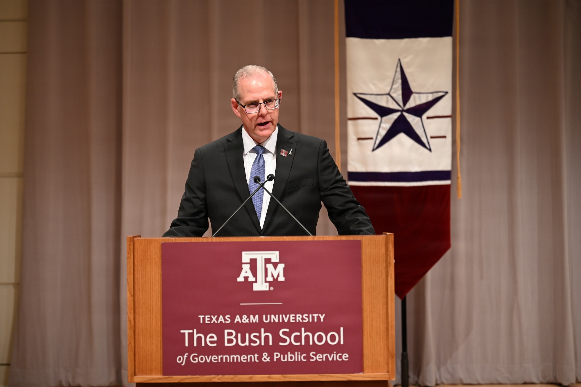 The Honorable John Sherman, dean of Texas A&M University’s Bush School of Government and Public Service, speaks during the Captain’s Leadership Course kickoff ceremony in College Station, Texas, Jan. 20, 2026. The partnership supports Space Training and Readiness Command’s effort to combine military expertise with civilian academic education for professional military education.