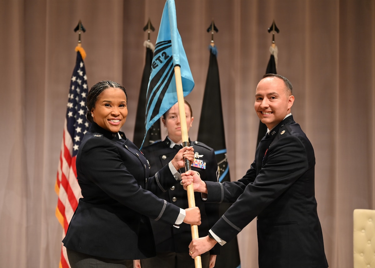 U.S. Space Force Col. Alison Gonzalez presents the command guidon to Lt. Col. Johann Pambianchi during an assumption of command ceremony for Space Delta 13 Detachment 2 at Texas A&M University in College Station, Texas, Jan. 20, 2026. Detachment 2 executes the Captain’s Leadership Course which began today in partnership with the university.