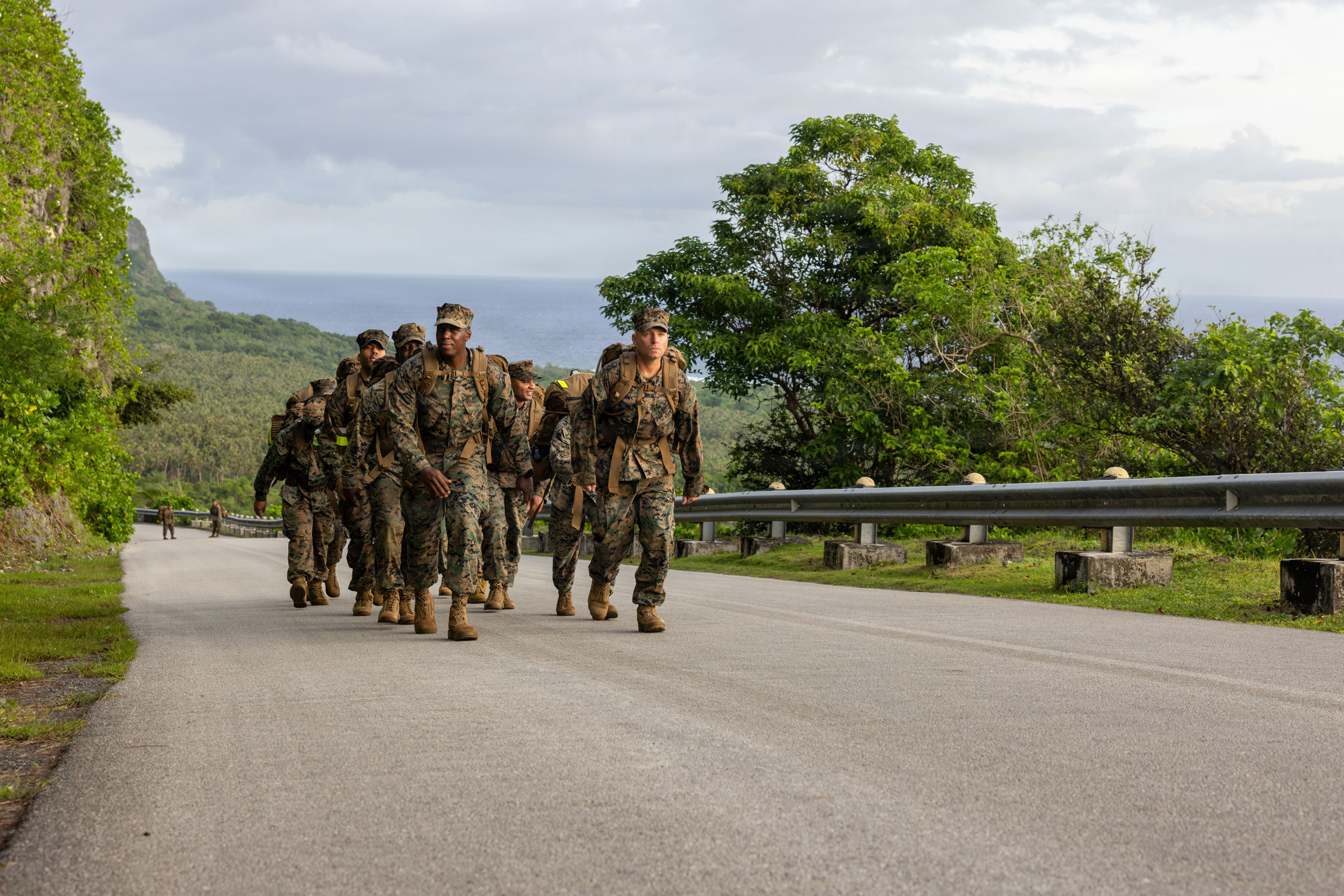 U.S. Marines with the S-6, Marine Corps Base Camp Blaz, conduct a 7.5-mile hike to Tarague Beach, Andersen Air Force Base, Guam, Jan. 9, 2026. The Marines led a section hike to increase unit cohesion, foster camaraderie and strengthen Esprit de Corps in preparation for a culminating 12-mile hike. (U.S. Marine Corps photo by Lance Cpl. Afton Smiley)