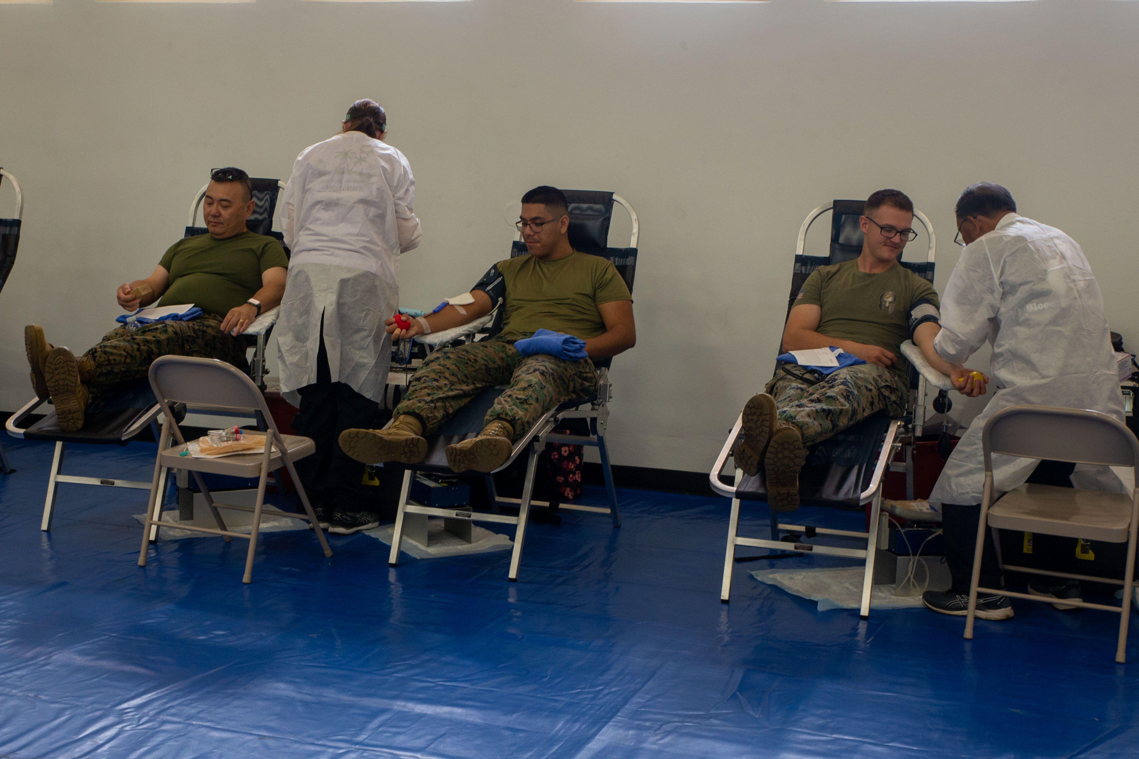 U.S. Marines and Sailors with Headquarters Company, Marine Corps Base Camp Blaz, donate blood during Camp Blaz’s first blood drive on MCB Camp Blaz, Guam, June 3, 2025. Camp Blaz partnered with Armed Services Blood Program Donor Center Guam and Naval Hospital Guam to help host a blood drive. (U.S. Marine Corps photo by Lance Cpl. Afton Smiley)