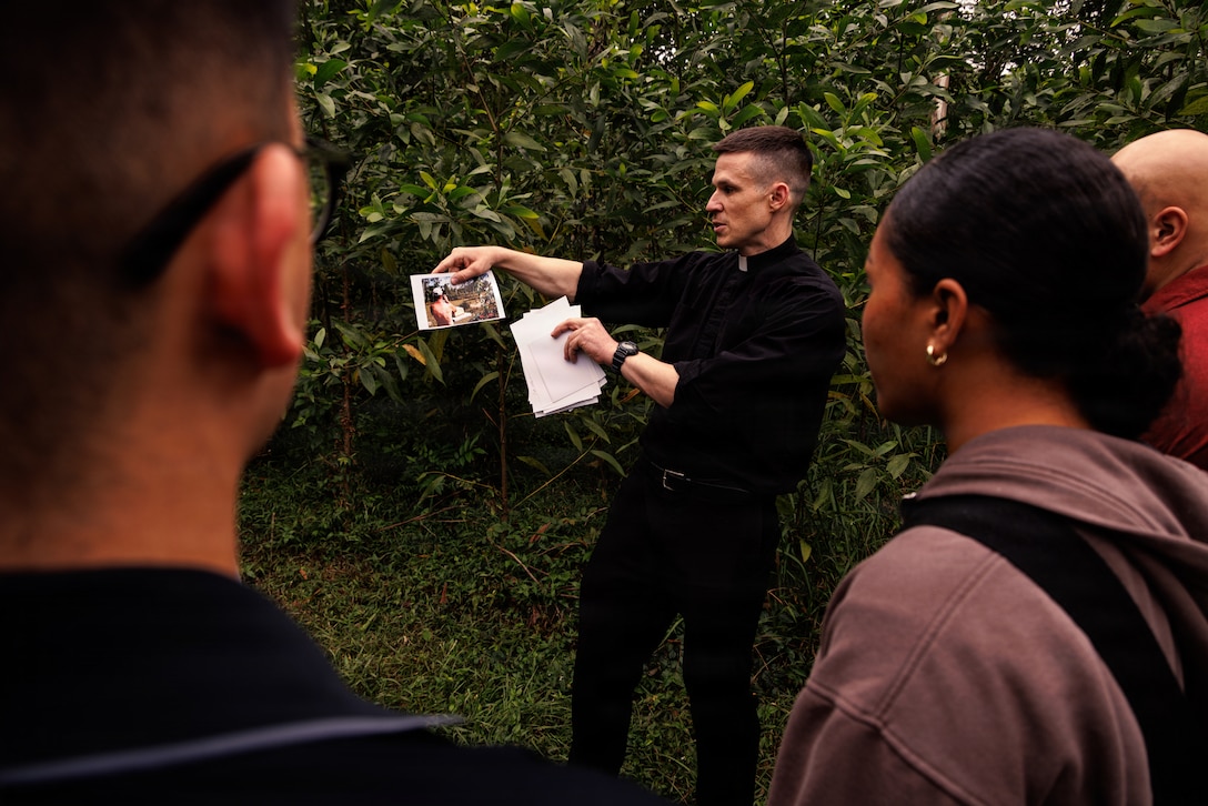U.S. Marines and Sailors with the 31st Marine Expeditionary Unit, look at photos during a tour of a battlefield in an area formerly known as the Que Son Valley near Da Nang, Vietnam, Jan. 10, 2026. Marines and Sailors visited this battle site to honor and show reverence for the service members who fought in the Vietnam War. The 31st MEU, the Marine Corps’ only continuously forward-deployed MEU, provides a flexible and lethal force ready to perform a wide range of military operations as the premiere crisis response force in the Indo-Pacific region. (U.S. Marine Corps photo by Lance Cpl. Victor Gurrola)