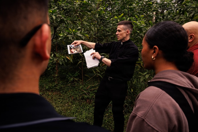 U.S. Marines and Sailors with the 31st Marine Expeditionary Unit, look at photos during a tour of a battlefield in an area formerly known as the Que Son Valley near Da Nang, Vietnam, Jan. 10, 2026. Marines and Sailors visited this battle site to honor and show reverence for the service members who fought in the Vietnam War. The 31st MEU, the Marine Corps’ only continuously forward-deployed MEU, provides a flexible and lethal force ready to perform a wide range of military operations as the premiere crisis response force in the Indo-Pacific region. (U.S. Marine Corps photo by Lance Cpl. Victor Gurrola)