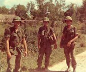 Lt. Vincent Capodanno, right, a chaplain with Mike Company, 3rd Battalion, 5th Marine Regiment, and two U.S. Marines in the same unit pose for a photo before Operation Swift in Vietnam, Sept. 4, 1967. Lt. Capodanno’s dedication and care for his Marines earned him the highest respect of those who served with him. For his selfless bravery, he was awarded the Medal of Honor, posthumously.