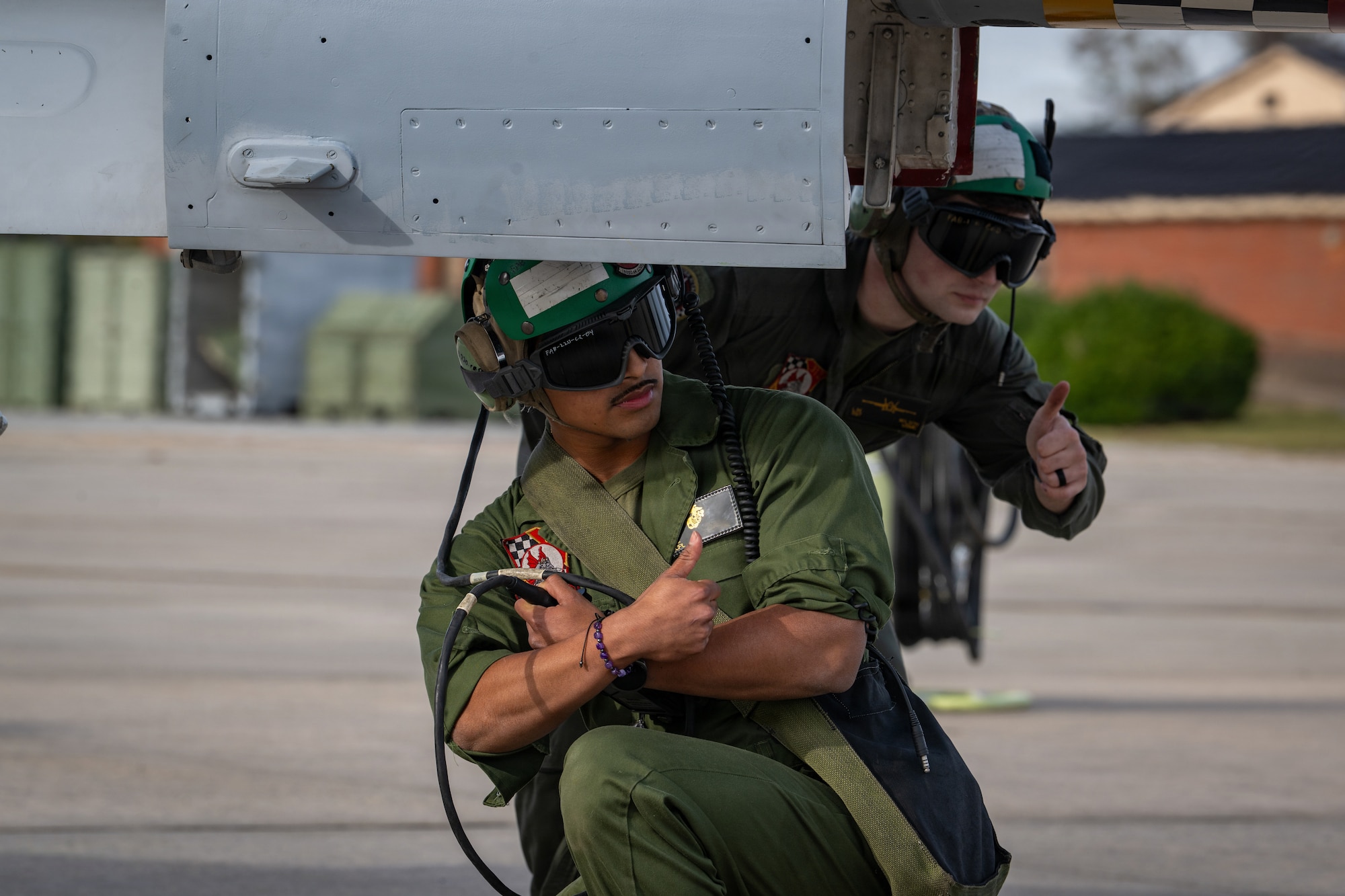 U.S. Marine Corps airframes mechanics assigned to Marine Fighter Attack Squadron 312 give a thumbs up during Combat Search and Rescue Training Exercise 26-1 at Moody Air Force Base, Georgia Jan. 12, 2026. CSARTE 26-1 emphasized joint planning and execution of flight operations supporting personnel recovery missions. (U.S. Air Force photo by Senior Airman Iain Stanley)