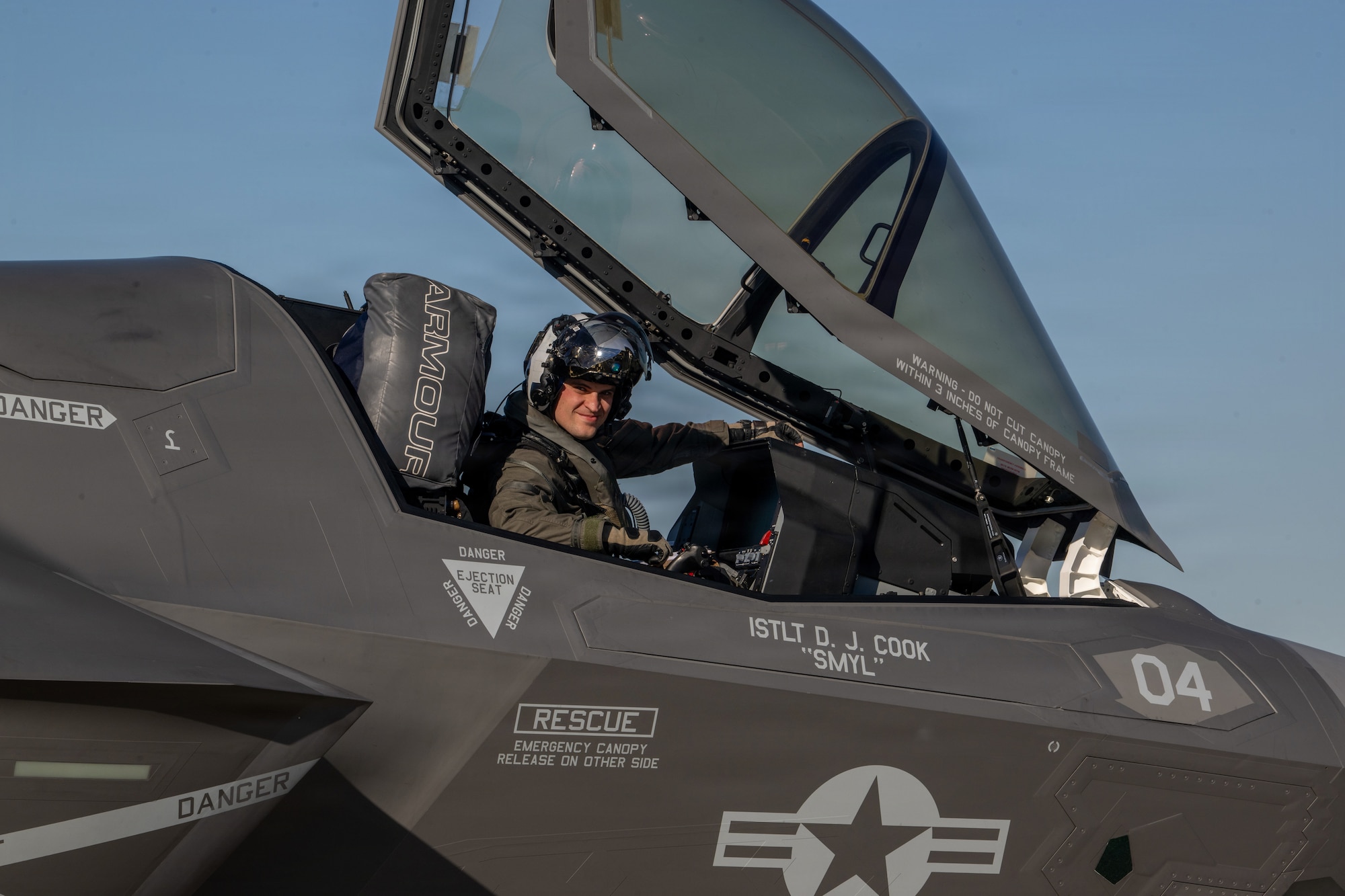 A U.S. Marine pilot assigned to Marine Fighter Attack Squadron 533 looks at the camera during a Combat Search and Rescue Training Exercise at Moody Air Force Base, Georgia Jan. 13, 2026. The exercise integrated multiple platforms to practice combat search and rescue, strike and escort missions in a near-peer environment. (U.S. Air Force photo by Senior Airman Iain Stanley)