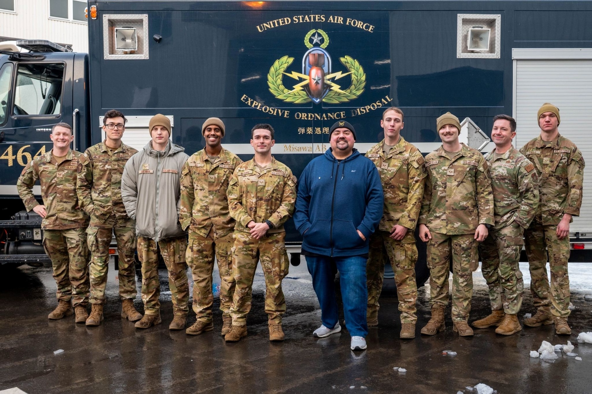 The 35th Civil Engineer Squadron Explosive Ordinance Disposal flight and comedian Gabriel “Fluffy” Iglesias, pose for a group photo during a squadron tour at Misawa Air Base, Japan, Jan. 17, 2026.