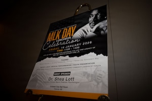 A sign sits at ceremony.