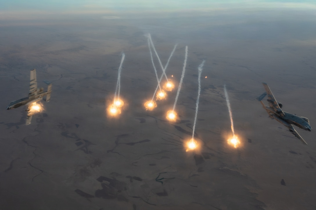 U.S. Air Force A-10C Thunderbolt II aircraft dispense flares over an undisclosed location within the U.S. Central Command area of responsibility, Jan. 5, 2026. The A-10 conducts operations across the AOR to provide close air support and combat airpower as necessary. (U.S. Air Force photo by Airman 1st Class Travis Knauss)