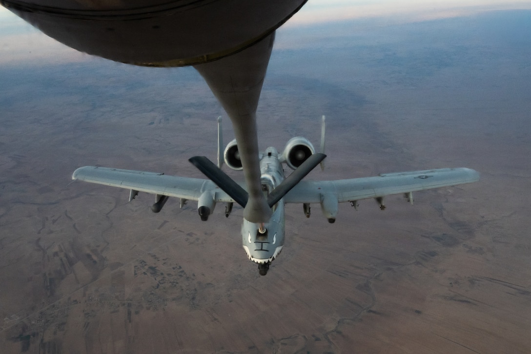 A U.S. Air Force A-10C Thunderbolt II aircraft receives fuel from a KC-135 Stratotanker aircraft assigned to the 74th Expeditionary Air Refueling Squadron during a mission within the U.S. Central Command area of responsibility, Jan. 5, 2026. The A-10 can loiter near battle areas for extended periods of time and operate in low ceiling and visibility conditions. (U.S. Air Force photo by Airman 1st Class Travis Knauss)